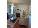 Inviting living room featuring a fireplace, plush seating, and natural light from the window at 8744 N Aspen Way, McCordsville, IN 46055
