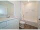 Clean bathroom featuring a vanity with white cabinets, a mirror, and a shower-tub combo at 895 Saddlebrook Farms Blvd, Whiteland, IN 46184