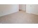 Bedroom featuring neutral carpeting, crisp white trim and two doors, ready for your personal touch at 895 Saddlebrook Farms Blvd, Whiteland, IN 46184