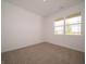Cozy bedroom with neutral carpet and a large window offering ample natural light at 895 Saddlebrook Farms Blvd, Whiteland, IN 46184