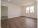 Bright bedroom with hardwood floors, natural light and attached entry to the en suite bathroom at 895 Saddlebrook Farms Blvd, Whiteland, IN 46184
