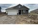 Charming single-story home featuring a brick facade, attached garage and covered entry at 895 Saddlebrook Farms Blvd, Whiteland, IN 46184