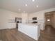Gourmet kitchen featuring a large island, stainless steel appliances, and ample storage space at 895 Saddlebrook Farms Blvd, Whiteland, IN 46184