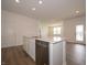 Bright kitchen island with stainless steel dishwasher and sink, perfect for entertaining at 895 Saddlebrook Farms Blvd, Whiteland, IN 46184