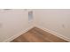 Bright laundry area with wood grain vinyl floors and white walls is ready for your washer and dryer at 895 Saddlebrook Farms Blvd, Whiteland, IN 46184