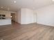 Open concept living room and kitchen area with vinyl wood flooring at 895 Saddlebrook Farms Blvd, Whiteland, IN 46184