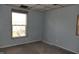 This bedroom features a window with a view of the outdoors and light gray walls at 917 W 27Th St, Indianapolis, IN 46208