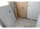 The entryway is unfinished with bare drywall and tiling on the floor at 917 W 27Th St, Indianapolis, IN 46208