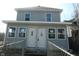 Two story home with gray siding, white trim and two front doors at 917 W 27Th St, Indianapolis, IN 46208