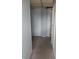 This hallway has neutral carpeting and light gray walls with white trim at 917 W 27Th St, Indianapolis, IN 46208