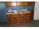 Close up of the kitchen sink and lower cabinets at 917 W 27Th St, Indianapolis, IN 46208