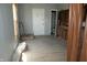 This kitchen features new wood floors and access to a bathroom with a toilet at 917 W 27Th St, Indianapolis, IN 46208