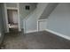 Living room with gray walls, carpet, and staircase at 917 W 27Th St, Indianapolis, IN 46208