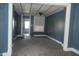 Living room with blue walls, carpet, and natural light from the window at 917 W 27Th St, Indianapolis, IN 46208