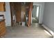 The room features wood floors and bare brick wall space exposed with brown curtain rods in place at 917 W 27Th St, Indianapolis, IN 46208