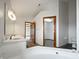 Bright bathroom with double vanity, soaking tub, and access to a walk-in closet at 9237 Stones Ferry Pl, Indianapolis, IN 46278