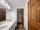 Bathroom featuring double sinks, a large mirror, and a separate shower room at 9237 Stones Ferry Pl, Indianapolis, IN 46278