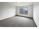 A simple bedroom offers natural light and comfortable carpeting, with a neutral palette at 9237 Stones Ferry Pl, Indianapolis, IN 46278