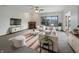 Bright and airy living room featuring a fireplace, large window, and stylish neutral furniture at 9237 Stones Ferry Pl, Indianapolis, IN 46278