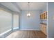 Well-lit dining area featuring hardwood floors, built-in cabinets, and bay windows at 9544 Huntington Ln, Indianapolis, IN 46260