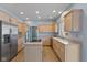 Bright kitchen featuring ample counter space, a kitchen island, and stainless steel appliances at 9544 Huntington Ln, Indianapolis, IN 46260