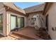 Exterior shot showcasing the patio with deck, brick pavers, and outdoor umbrella at 9544 Huntington Ln, Indianapolis, IN 46260