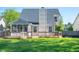 Backyard features a wooden deck and screened-in porch, perfect for entertaining or relaxing outdoors at 9705 Shasta Dr, Fishers, IN 46038