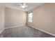 Neutral bedroom featuring natural lighting, carpet, and a ceiling fan at 9705 Shasta Dr, Fishers, IN 46038
