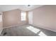 Bedroom with neutral carpet, a window, and a light fixture at 9705 Shasta Dr, Fishers, IN 46038