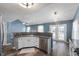 Modern kitchen with stainless steel appliances, granite countertops, and a breakfast bar at 9705 Shasta Dr, Fishers, IN 46038
