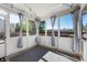 Screened patio with curtains, string lights, and outdoor views at 9705 Shasta Dr, Fishers, IN 46038