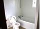 Bathroom features standard white toilet and tub at 10327 Old National Rd, Indianapolis, IN 46231