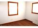 Bedroom featuring hardwood flooring, neutral paint and windows for natural light at 10327 Old National Rd, Indianapolis, IN 46231