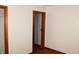 Bedroom featuring hardwood floors, neutral paint and a closet at 10327 Old National Rd, Indianapolis, IN 46231