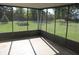 Enclosed patio featuring concrete flooring and views of the backyard at 10327 Old National Rd, Indianapolis, IN 46231