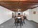 Large finished basement with exposed ceiling, dining table, and bonus space at 1035 N Audubon Rd, Indianapolis, IN 46219