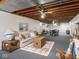 Finished basement provides ample space for recreation with seating area and game table at 1035 N Audubon Rd, Indianapolis, IN 46219