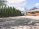 Long driveway with privacy row of mature arborvitae at 1035 N Audubon Rd, Indianapolis, IN 46219