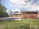 Brick ranch home with large driveway and spacious backyard at 1035 N Audubon Rd, Indianapolis, IN 46219