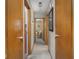 Hallway with multiple doors to different rooms, showing the layout at 1035 N Audubon Rd, Indianapolis, IN 46219