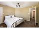 This carpeted bedroom includes a queen bed, overhead lighting and neutral paint at 1083 Sugar Maple Dr, Greenwood, IN 46143