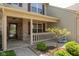 Inviting front porch with decorative columns, stylish welcome sign, and charming landscaping at 1083 Sugar Maple Dr, Greenwood, IN 46143
