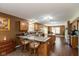 Bright kitchen with granite countertops, stainless steel appliances, and an island with seating at 1083 Sugar Maple Dr, Greenwood, IN 46143