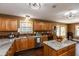 Spacious kitchen featuring custom wood cabinetry, granite countertops, and a central island at 1083 Sugar Maple Dr, Greenwood, IN 46143