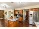 Kitchen featuring stainless steel appliances, wood cabinets, granite countertops, and island with bar seating at 1083 Sugar Maple Dr, Greenwood, IN 46143