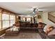 Comfortable living room with a large sectional sofa, and an open view to the kitchen at 1083 Sugar Maple Dr, Greenwood, IN 46143