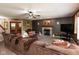 Inviting living room featuring a cozy fireplace, and a comfortable sectional sofa at 1083 Sugar Maple Dr, Greenwood, IN 46143