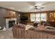 Inviting living room featuring a fireplace, large sofa, and open access to the kitchen at 1083 Sugar Maple Dr, Greenwood, IN 46143