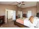 Comfortable primary bedroom with carpeted floor, ceiling fan, en-suite access, and vaulted ceiling at 1083 Sugar Maple Dr, Greenwood, IN 46143