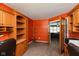 Home office featuring custom built-in shelves and cabinetry with a large window with a view of the backyard at 1083 Sugar Maple Dr, Greenwood, IN 46143